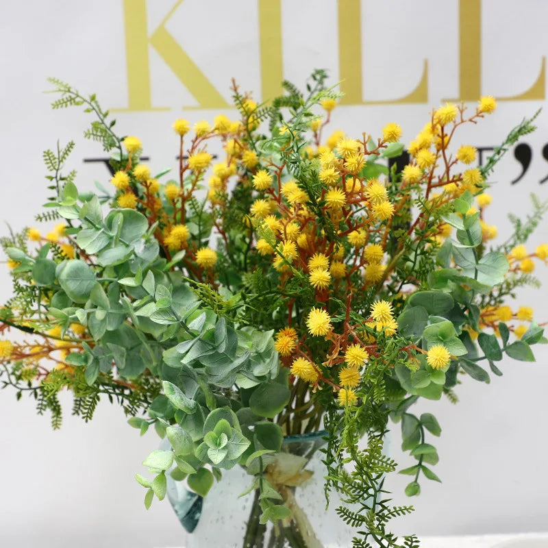 décoration intérieure bouquet artificiel feuilles vertes fleurs blanches jaunes roses naturel salon jardin