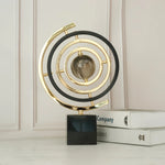 sphère artificielle moderne marbrée dorée noire décoration intérieure base carrée geometrique
