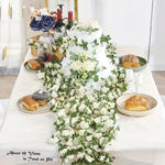 guirlande fleurs artificielles roses blanches feuilles vertes décoration extérieure mariage romantique