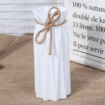 vases décoratifs modernes plissés fleurs artificielles couleurs variées salon minimaliste
