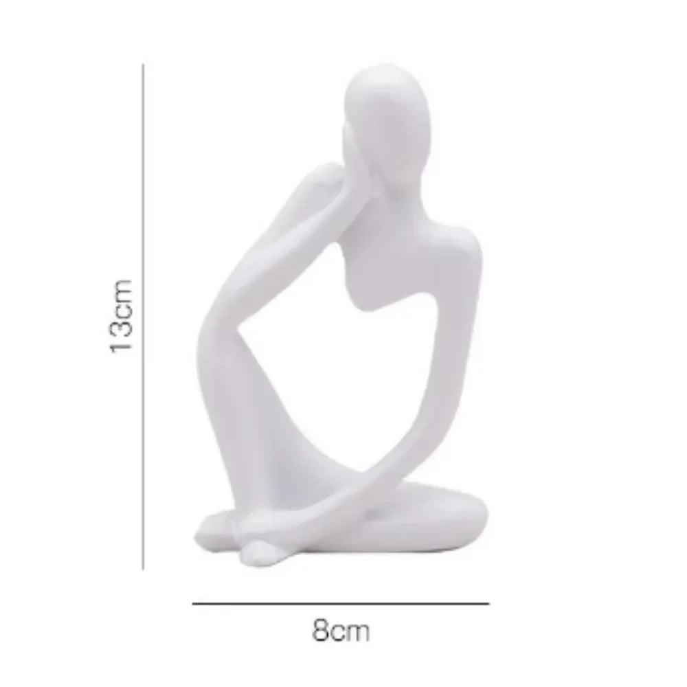 statue décorative moderne figure humaine assise couleur or noir beige.texture granuleuse surface lisseintérieur moderne