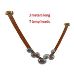 Suspension lumineuse contemporaine boules translucides structure métallique noir marron doré minimaliste