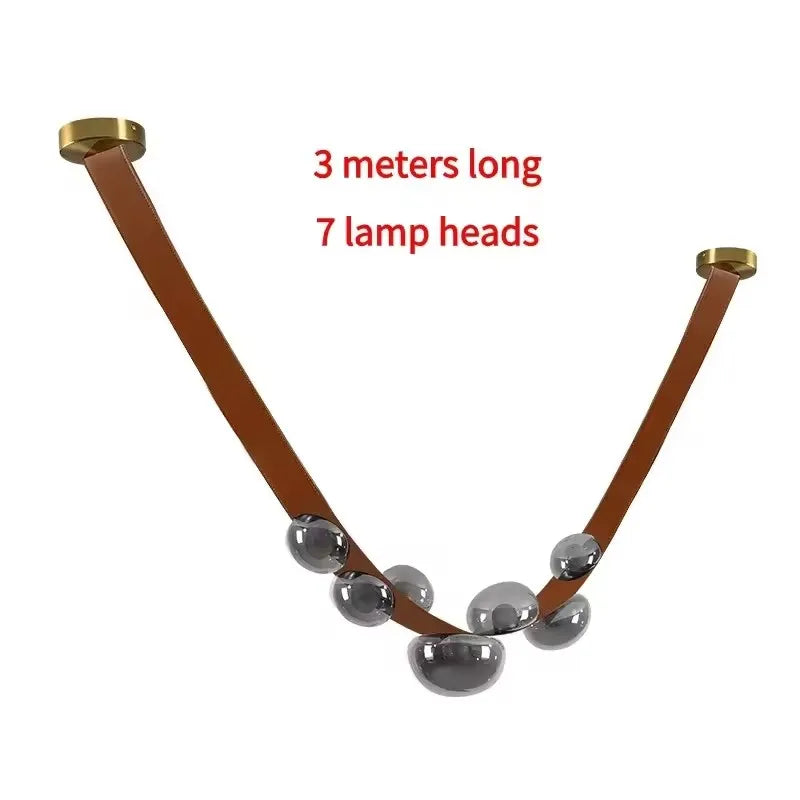 Suspension lumineuse contemporaine boules translucides structure métallique noir marron doré minimaliste