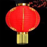 lanterne traditionnelle rouge dorée motifs chinois franges anneaux métalliques nouvelle année chinois decoration festive