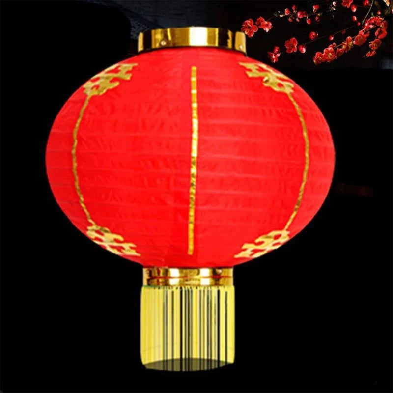lanterne traditionnelle rouge dorée motifs chinois franges anneaux métalliques nouvelle année chinois decoration festive