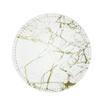 Assiette ronde en marbre blanc et or avec des motifs de veinures dorées, reflet d'un style élégant et épuré.