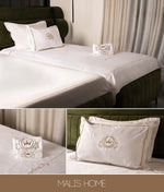 draps coton brodés couronne élégants oreillers couette literie chambre blanc motifs floraux