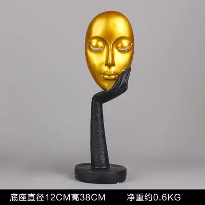 masque sculptural contemporain noir blanc doré finement sculpté base circulaire ornement salon