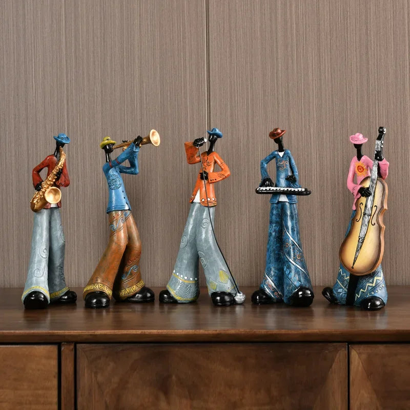 statues musiciens résine trompette saxophone chanteur clavier violoncelle ethnique artisanal décoration maison salon