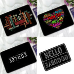 tapis antidérapant polygoneux motifs textes multilingue couleurs vives porte sol moderne