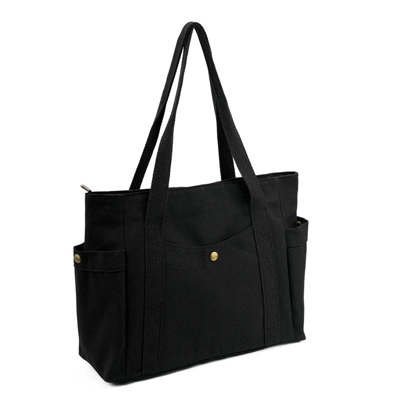 sac cabas noir toile voyage poches extérieures poche intérieure zippée anse tissu utilitaire décontracté