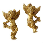 statues d'anges dorées détails sculpturaux classiques brillants intérieur chambre salon
