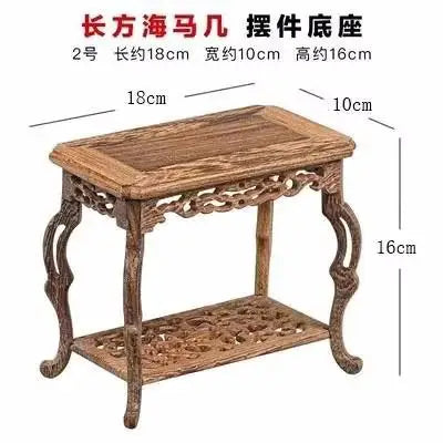 table basse bois rose classique gravures artisanal marron clair pot plante figurine cadre photo