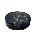 Cet ensemble de sous-verres ronds en verre foncé présente un motif de marbre noir et doré élégant et sophistiqué.