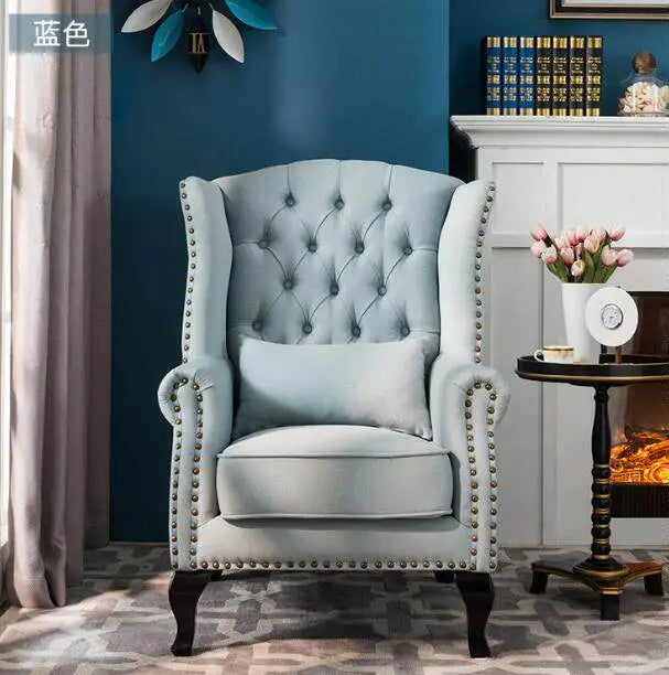 fauteuil club chesterfield tissu capitonné coussins décoratifs bois sculpté living room adult single sofa