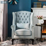 fauteuil club chesterfield tissu capitonné coussins décoratifs bois sculpté living room adult single sofa
