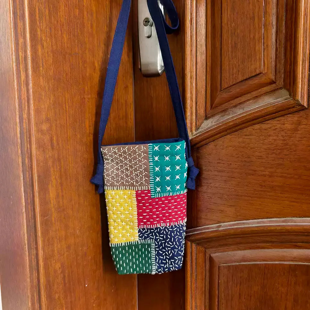 sac main multicolore patchwork motifs géométriques opacité créatif bandelette noire 19x13cm