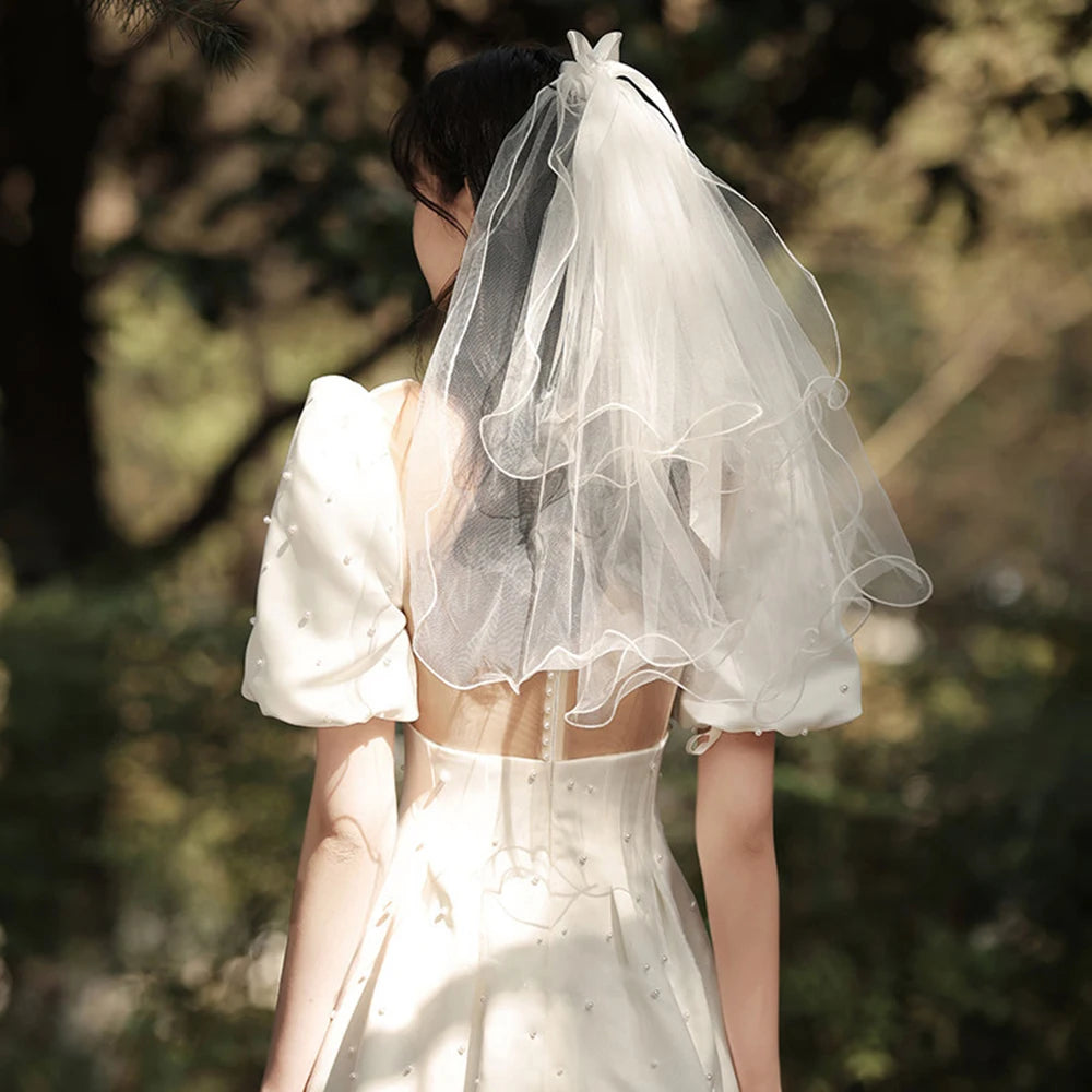 voile mariée tulle plissé blanc classique romantique fixé noeud transparent élégant