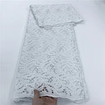 tissu dentelle coton blanc motifs floraux broderie strass robe couture luxe