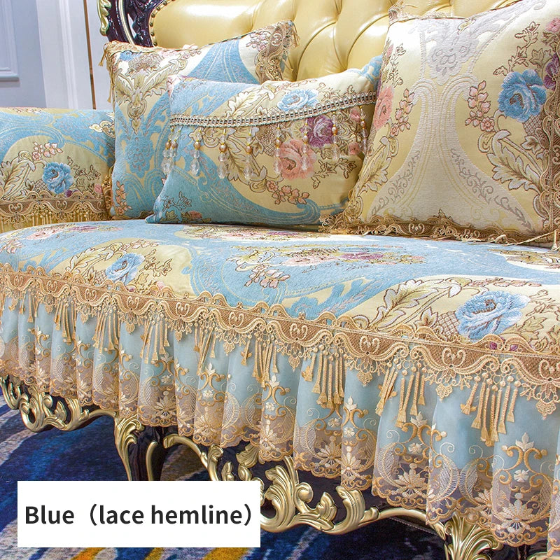 Un magnifique ensemble décoratif de coussins et de couvertures ornés de motifs floraux délicats sur un fond bleu, rehaussés de dentelle dorée et de détails raffinés.