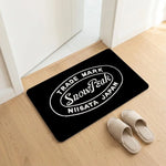 tapis sol noir logo snow peak minimaliste antidérapant bain moderne camping usage