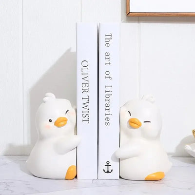 Serre-livres canard décoratif en résine bleu sur étagère