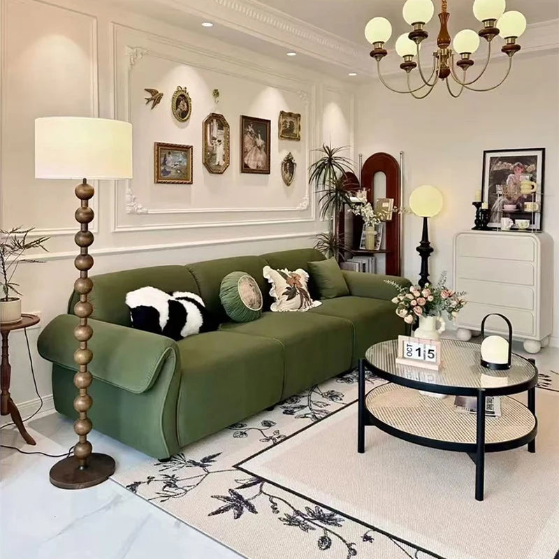 canapé vert olive moderne tissu uni bois coussins décoratifs sectionnel français minimaliste