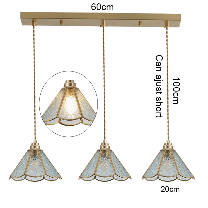 suspension lumineuse verre teinté art deco or marron bleu clair motifs géométriques opacité chaînes
