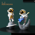 statue astronaute résine saxophone doré guitare violoncelle moderne décoration intérieure chambre salon
