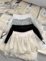 jupe élastique minijupe dessus genou élégante tulle noir blanc féminine chic translucide boutons
