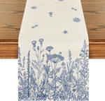 Un motif botanique détaillé avec une diversité de fleurs des champs et d'herbes sauvages imprimé sur un fond crème.