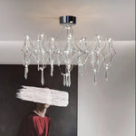 lustre moderne or cristaux transparents branches stylisées salon chambre principale