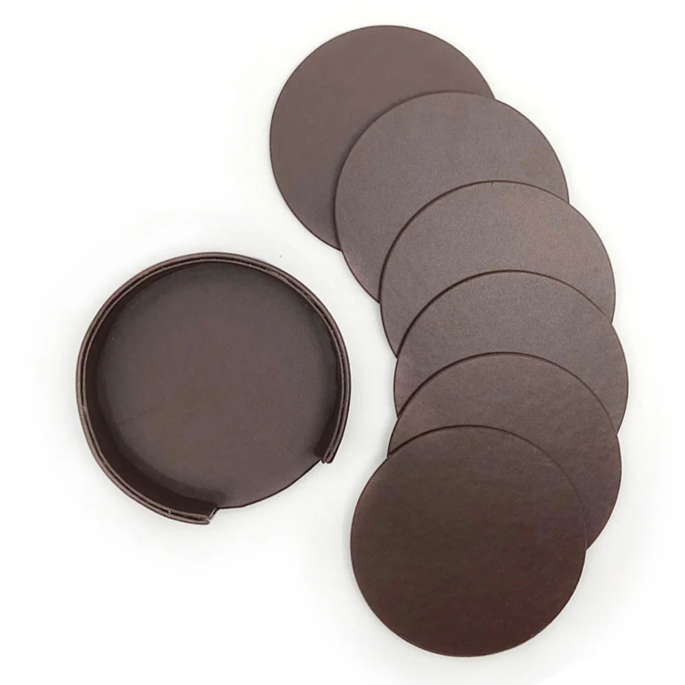 Assortiment de disques de ponçage ronds en différentes tailles, présentés sur un fond blanc.