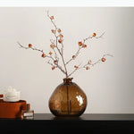 vase transparent brun clair forme arrondie branches fleurs décoration table moderne transparent texture bosselée