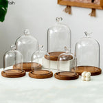 cloche verre transparent base bois bougie parfumée pinçon décoratives