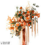 arche décorative boho chic fleurs artificielles orange feuilles vertes franges blanches extérieur mariage anniversaireévénement