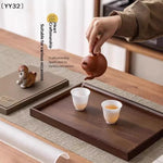 plateau thé noir noisetier minimaliste poignées théière céramique tasses blanches