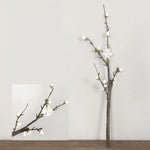 décoration intérieure bouquet fleurs prunier artificielles rose blanches vase transparent minimaliste asian