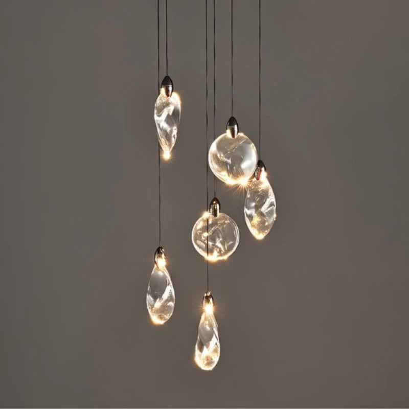 Suspension lumineuse moderne transparente noir doré liquide ondulé très transparent câble noir