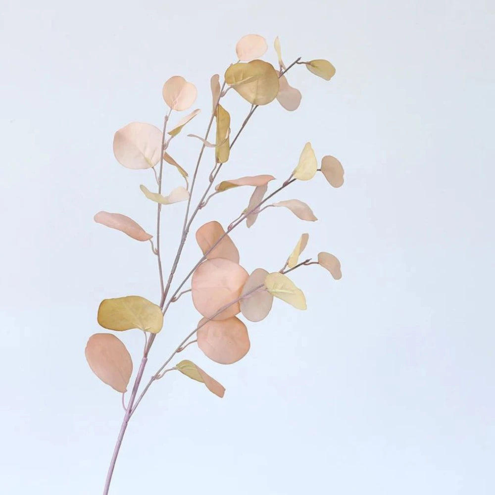 bouquet artificiel feuilles ovales moderne vase transparent support doré couleurs vives exposition intérieure