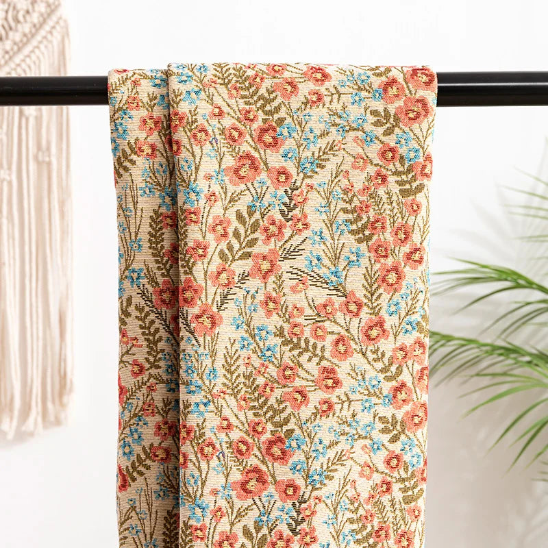 tissu fleuri vintage polyester coton fleurs feuilles chats beiges bleus rouges verts marrons résistance