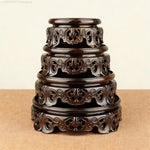 support bois ornements sculptés complexe artisanal marron foncé traditionnel décoration maison objet décoratif stand
