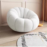 fauteuil moderne velours bouclé doux repos pieds beige clair intérieur meubles salon contemporain