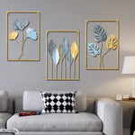 décoration murale métal feuilles stylisées bleu doré jaune art moderne salon maison intérieur