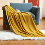 couverture lit orange motif waffle texture bulles confortable moderne canapé salon maison