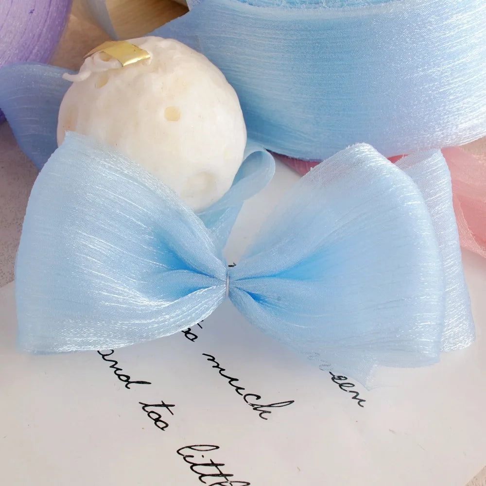 ruban voile polyester double face blanc rose pâle bleu clair mariage artisanal élégant plissé