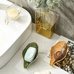 porte savon feuille transparente bord doré motif rayonné savon blanc vert orange moderne élégant