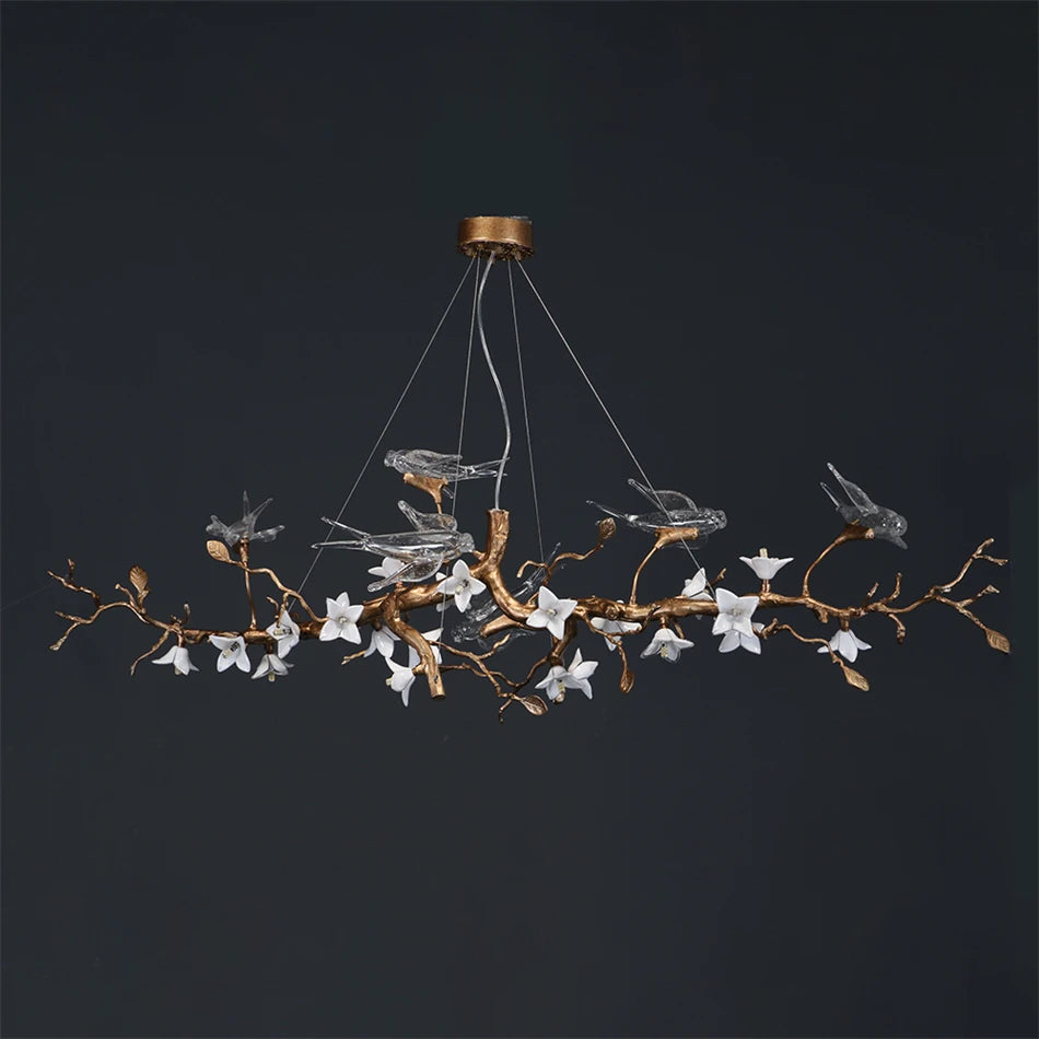 Suspension lumineuse moderne oiseaux transparents branches dorées fleurs blanches led verre chrome poli chambre