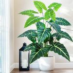 plante artificielle moderne arbre monstera feuilles vertes decoration intérieure pot blanc contemporain exposition maison