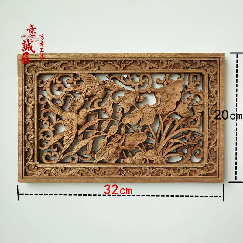 Détail sculpture dragon phénix bois camphre
